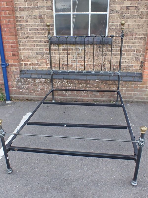 A VICTORIAN STYLE IRON DOUBLE BEDSTEAD