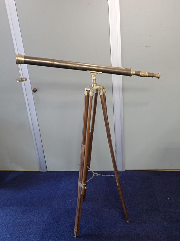 A BRASS TELESCOPE AND TRIPOD