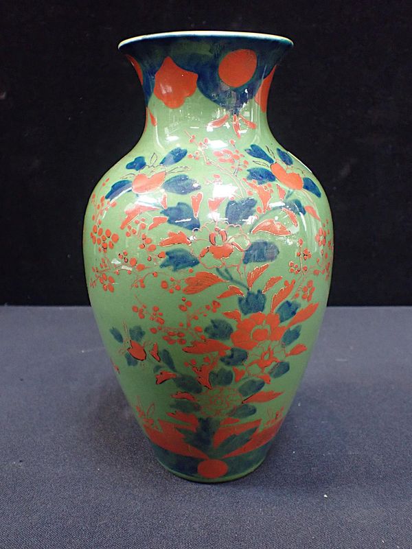 A JAPANESE GREEN GLAZED BALUSTER VASE