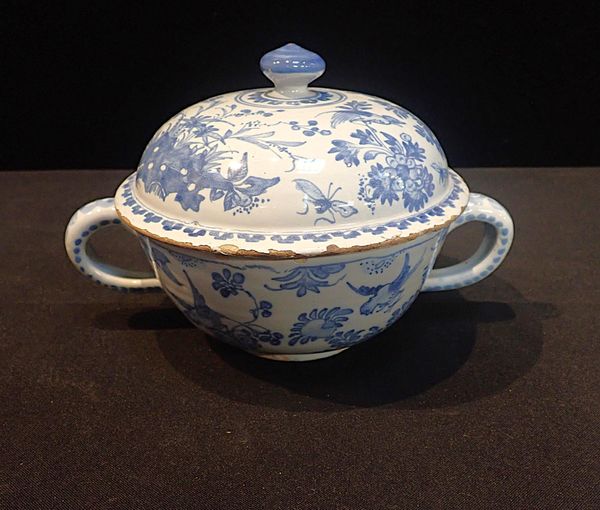 A LATE 18th CENTURY DUTCH DELFT TWO-HANDLED COVERED BOWL