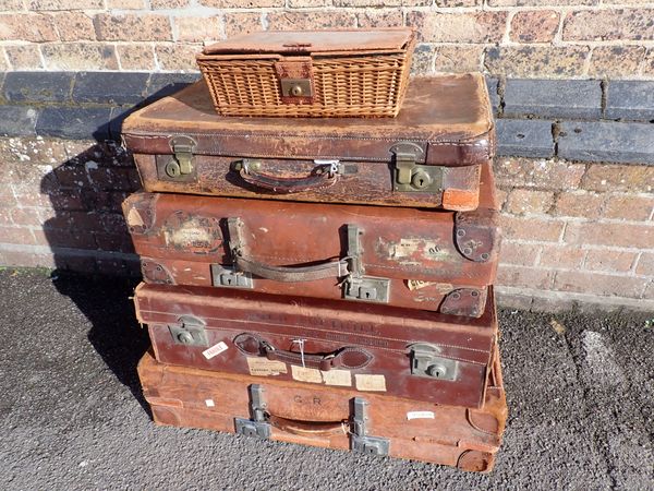 FOUR VINTAGE LEATHER SUITCASES, ONE STAMPED 'LORD AMPTHILL'