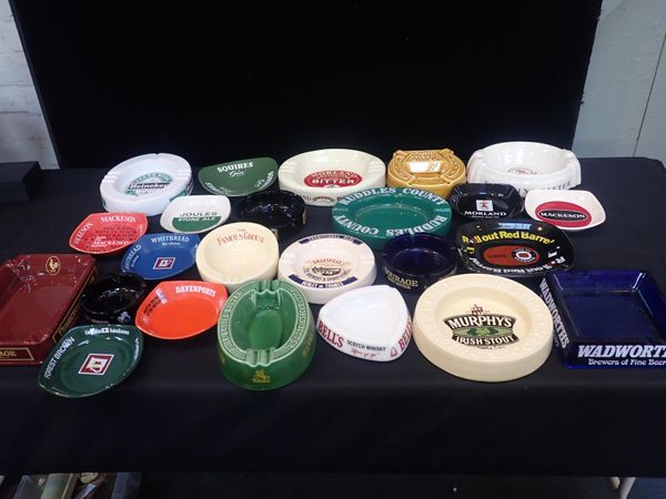 A COLLECTION OF PUB ADVERTISING ASH TRAYS
