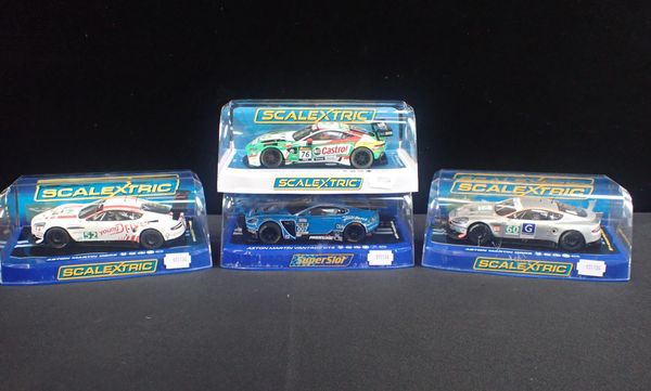 FOUR BOXED SCALEXTRIC 'ASTON MARTIN' RACING CARS