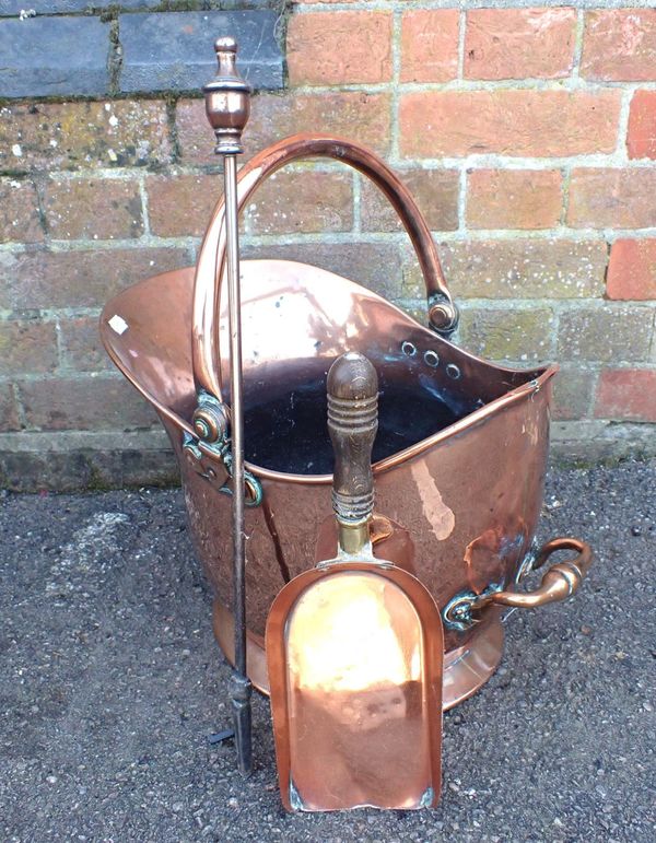 A COPPER HELMET-SHAPE COAL SCUTTLE