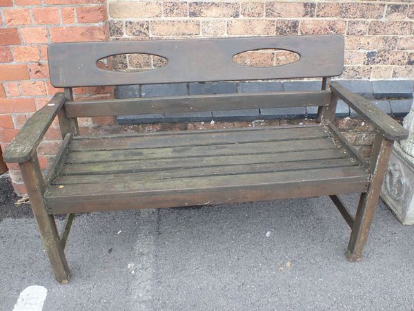 A WEATHERED GARDEN BENCH