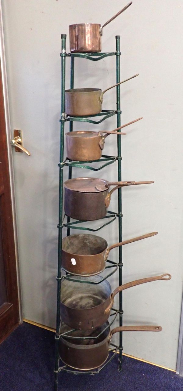 A SEVEN TIER PAN STAND, VARIOUS COPPER PANS