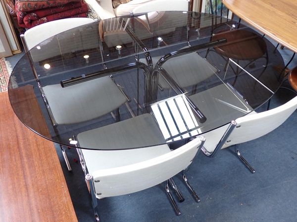 A RETRO SMOKED GLASS AND CHROME DINING TABLE AND FOUR CHAIRS
