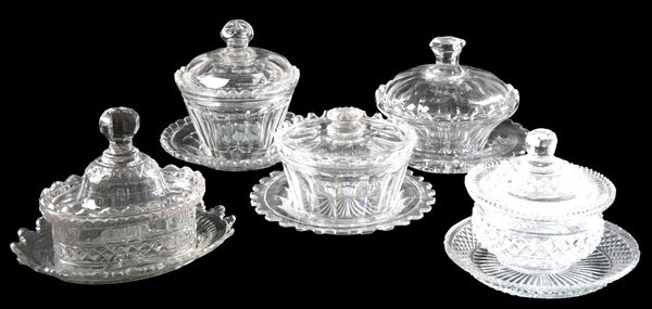 A GROUP OF FIVE ENGLISH CUT GLASS BOXES, COVERS AND STANDS