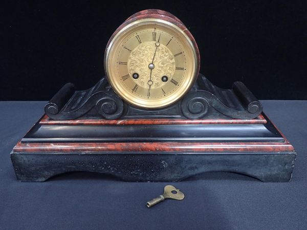 A FRENCH DRUMHEAD SLATE AND RED MARBLE CASED MANTEL CLOCK