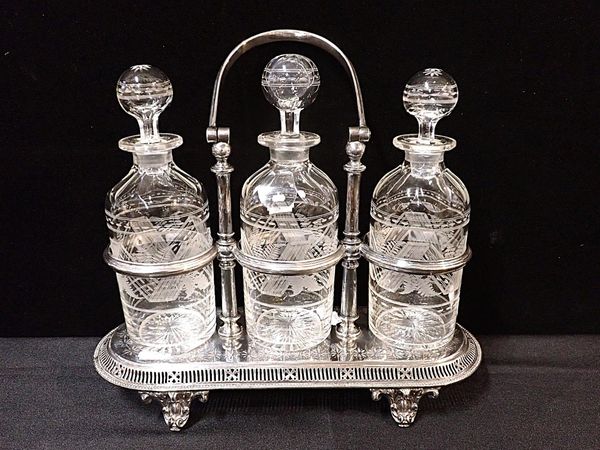 A VICTORIAN SILVER-PLATED TRIPLE DECANTER CRUET