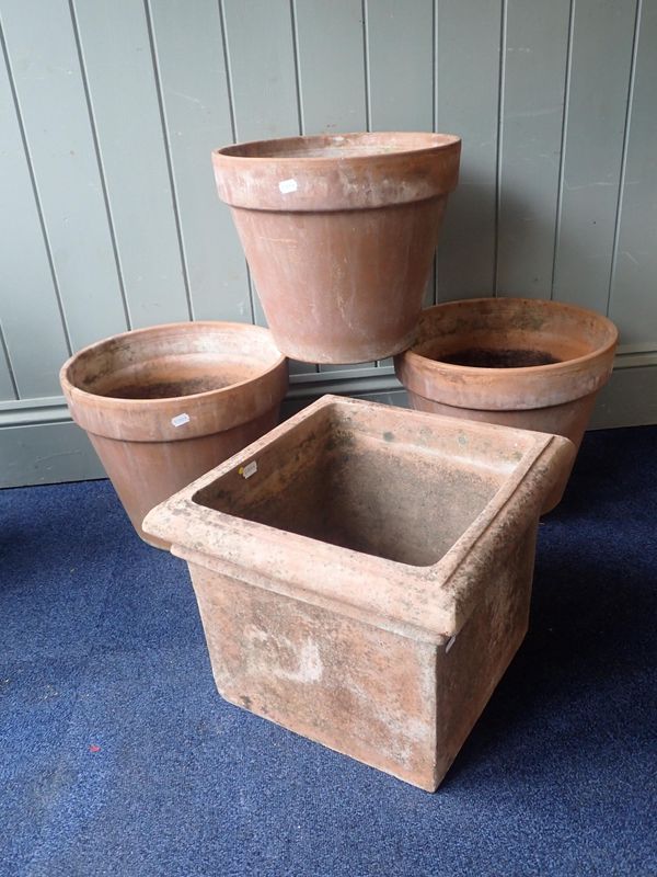 A SQUARE TERRACOTTA GARDEN PLANTER