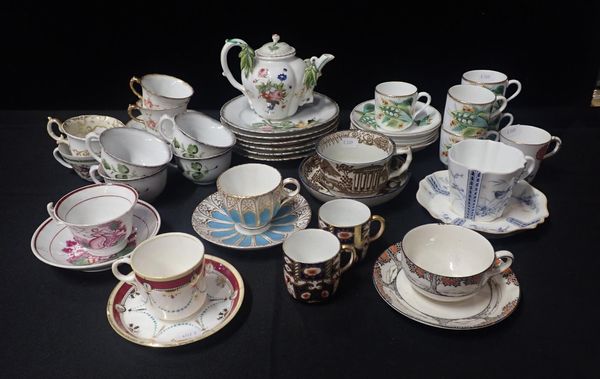 A COLLECTION OF DECORATIVE CUPS AND SAUCERS