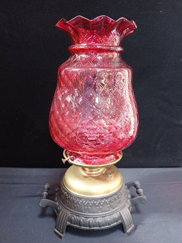 A VICTORIAN CONSERVATORY LAMP WITH LARGE CRANBERRY SHADE