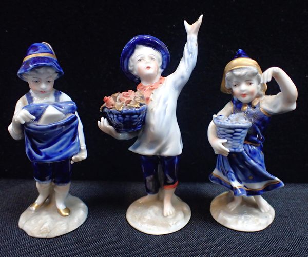 THREE 19TH CENTURY GERMAN PORCELAIN FIGURES OF CHILDREN