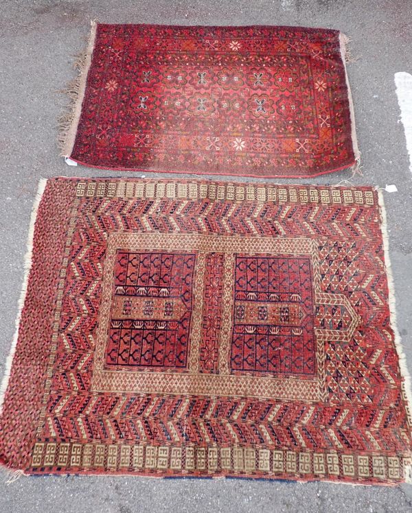 A RED GROUND PRAYER RUG