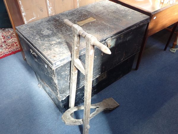 AN EDWARDIAN FOLDING WOODEN BOOT JACK