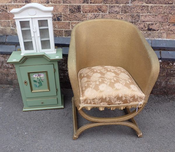A LLOYD LOOM STYLE ARMCHAIR