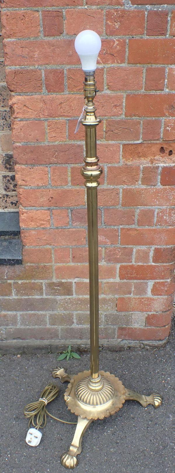 A BRASS STANDARD LAMP