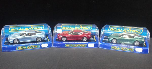 THREE BOXED SCALEXTRIC 'ASTON MARTIN DBS' CARS