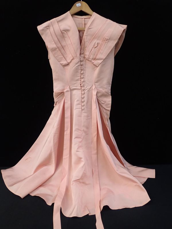 A 1950S PINK DRESS