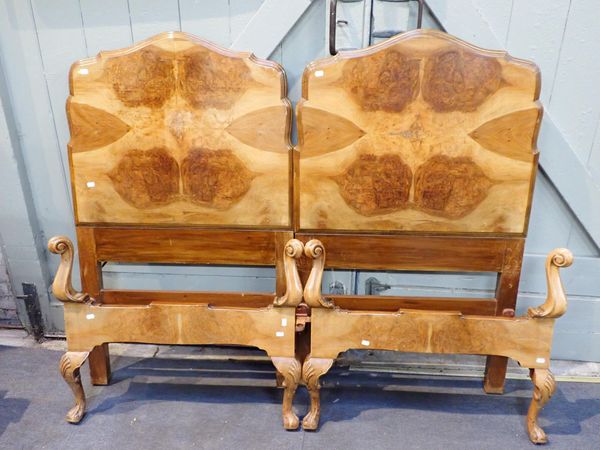 A PAIR OF 1930s FIGURED WALNUT SINGLE BEDS