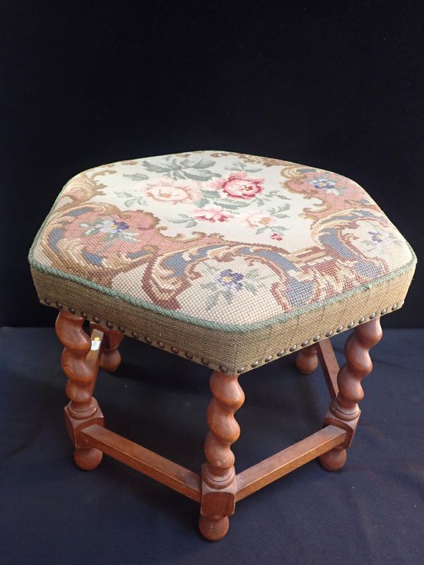 A CONTINENTAL HEXAGONAL STOOL WITH BARLEY-TWIST LEGS