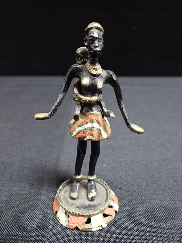 A COLD PAINTED BRONZE OF MASSAI WOMAN WITH BABY