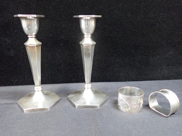 A PAIR OF SILVER CANDLESTICKS OF HEXAGONAL FORM