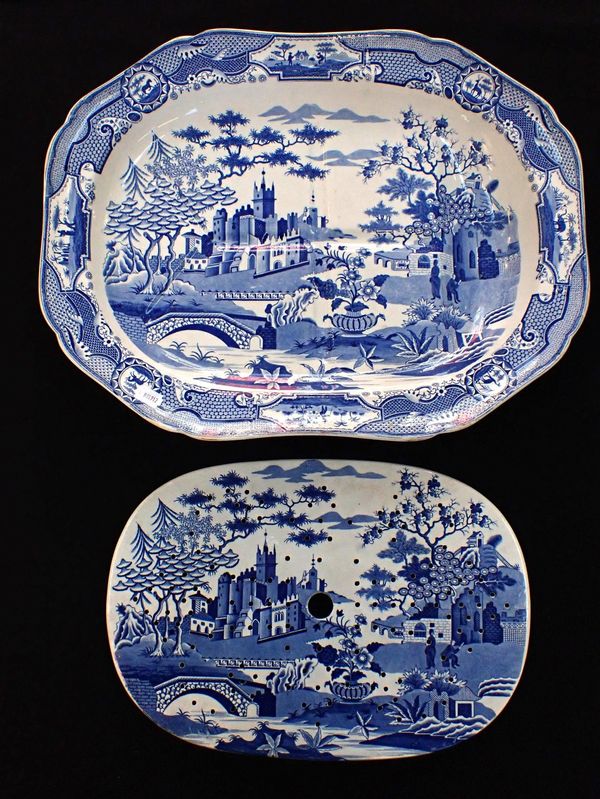 A BLUE AND WHITE 'GOTHIC CASTLE' MEAT DISH AND MATCHING DRAINER