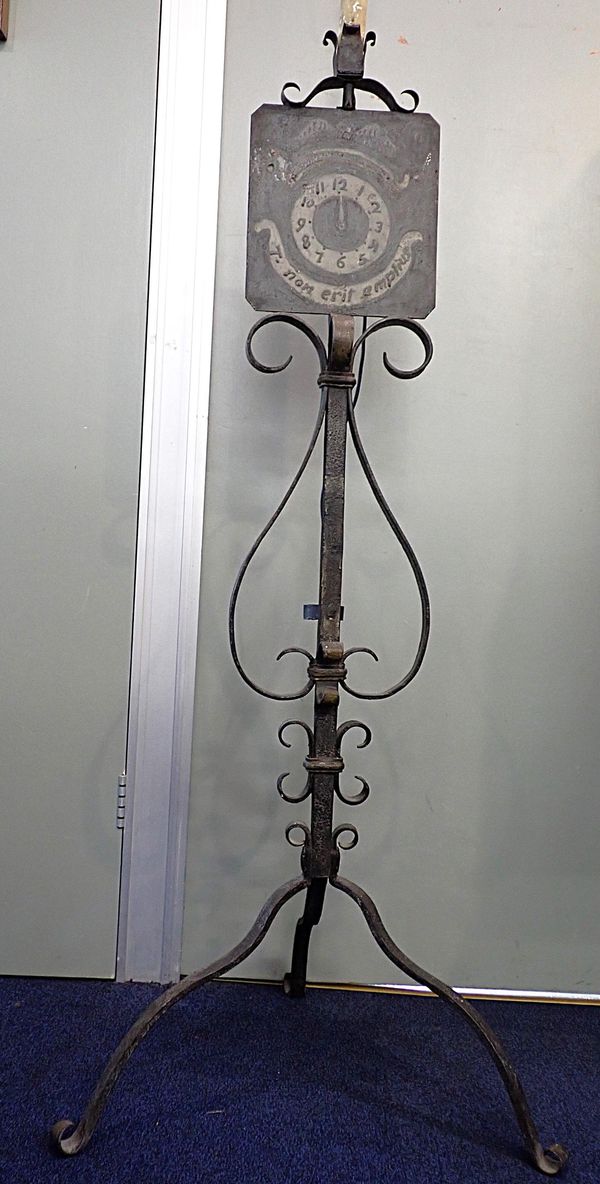 A WROUGHT IRON STANDARD LAMP