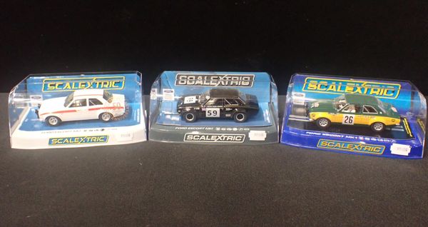 THREE BOXED SCALEXTRIC 'FORD ESCORT MK1' CARS