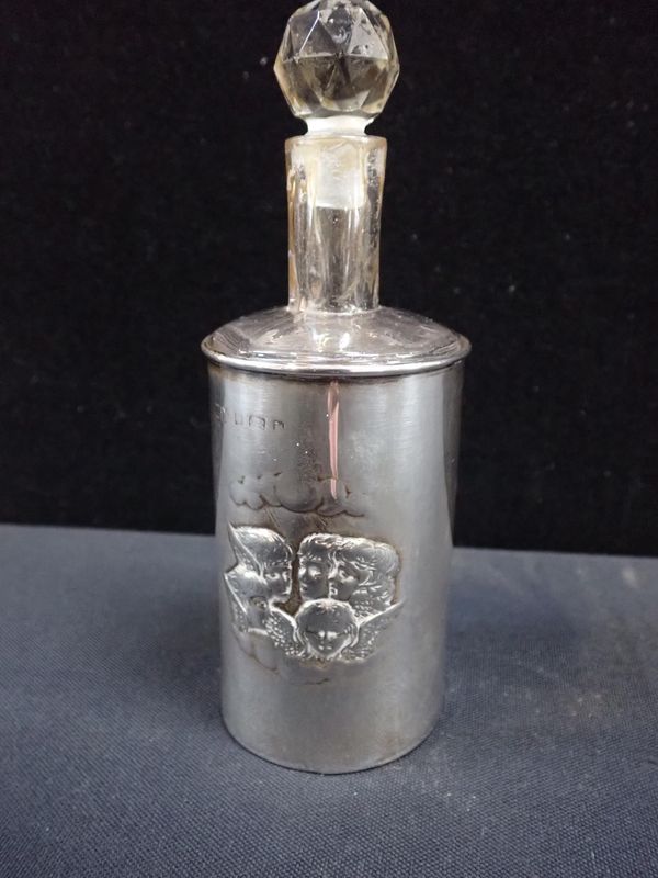 A SILVER BOTTLE CASE, WITH CHERUBIC DECORATION