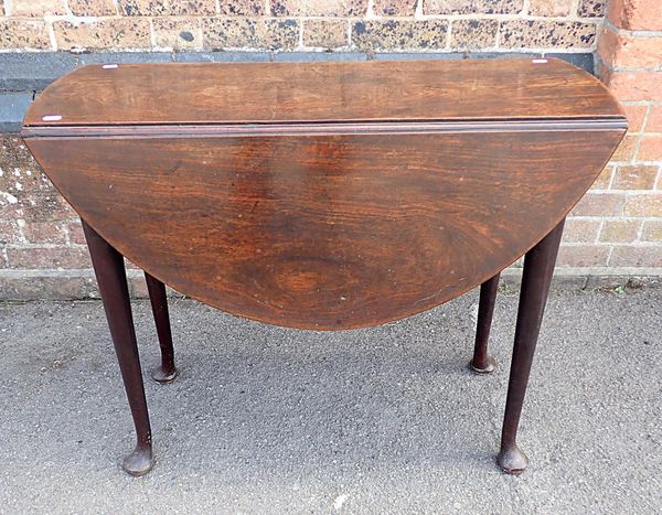 A GEORGE II MAHOGANY OVAL DROP FLAP TABLE