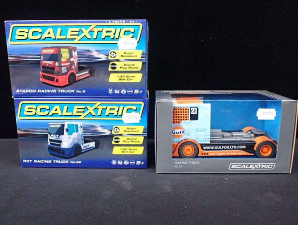 THREE BOXED SCALETRIC RACING TRUCKS