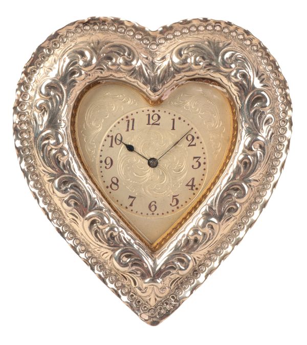 A VICTORIAN SILVER FRONTED HEART SHAPED MANTEL TIMEPIECE