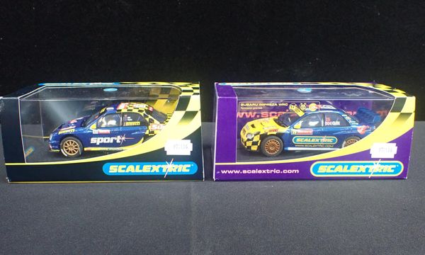 TWO BOXED SCALEXTRIC 'SUBARU IMPREZA WRC' CARS