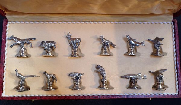 A SET OF TWELVE SILVER-PLATED PLACECARD/MENU HOLDERS