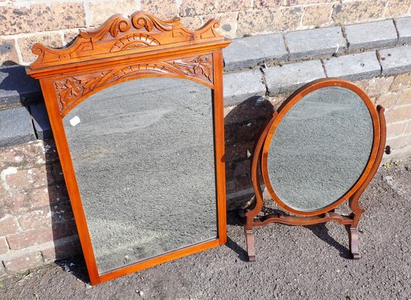 A MAHOGANY FRAMED OVAL TOILET MIRROR