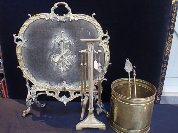 A CAST BRASS FIRESCREEN