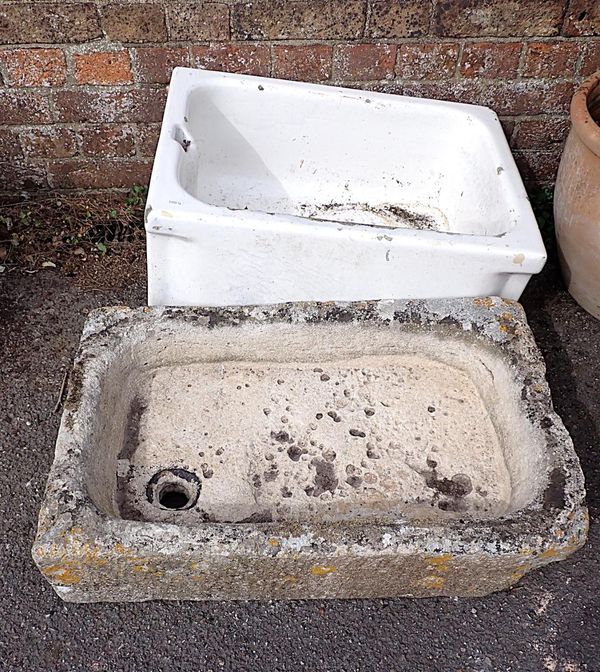 AN OLD SHALLOW STONE SINK