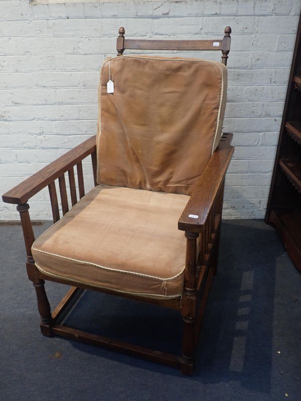 A 1920'S OAK RECLINING ARM CHAIR