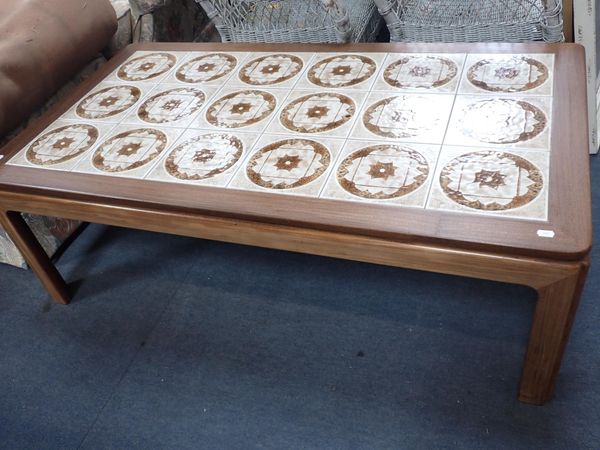 A MID-CENTURY STYLE COFFEE TABLE WITH TILED TOP