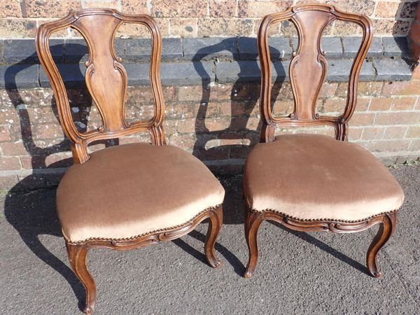 A PAIR OF FRENCH WALNUT AND BEECH BEDROOM CHAIRS