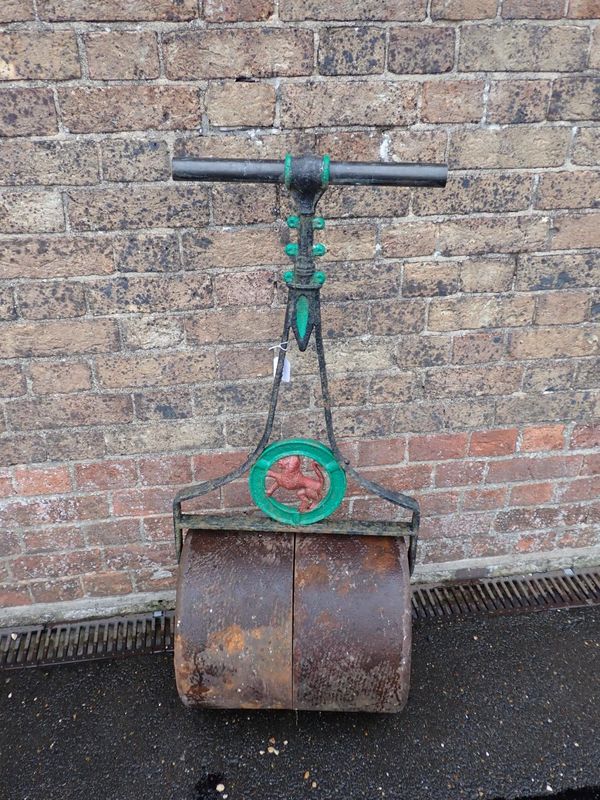 AN ANTIQUE CAST-IRON GARDEN ROLLER