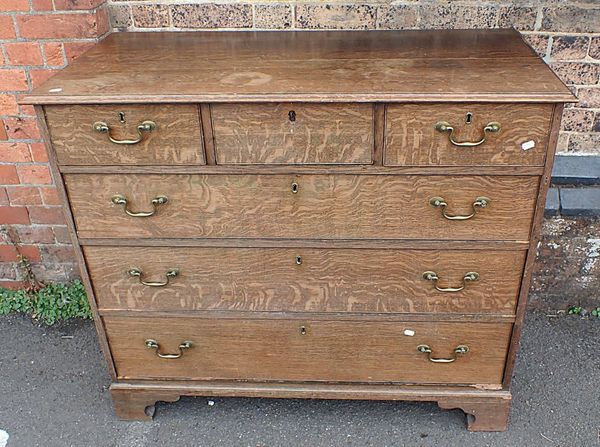 A GEORGE III OAK CHEST OF DRAWERS