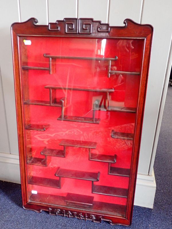 A CHINESE HARDWOOD GLAZED DISPLAY CABINET