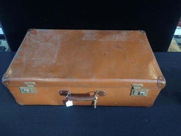 A LARGE VINTAGE COMPOSITION SUITCASE
