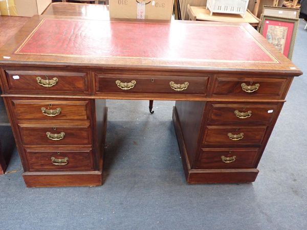 AN EDWARDIAN WALNUT PEDESTAL DESK