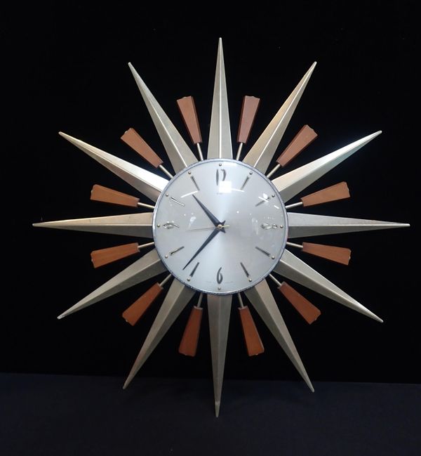 A RETRO METAMEX SUNBURST WALL CLOCK