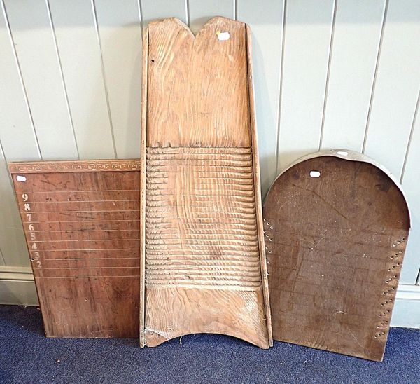AN ANTIQUE WOODEN WASHBOARD